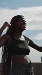 Fist pump, runner and woman outdoor with smart watch for fitness goals, exercise and celebration. Sports, athlete and African person with running achievement, endurance and training with health stats