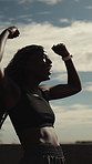 Fist pump, athlete and woman in city with smart watch for fitness goals, exercise and celebration. Sports, runner and black person with running achievement, endurance and training with health stats