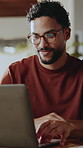 Man, reading and laptop at house for remote work, research and confirm facts for story submission. Smile, freelancer or review in home with tech, editing grammar and latest update of article coverage
