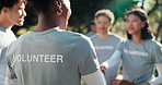 Charity, volunteer team and handshake in park for support, community service or donation for relief. Shaking hands, NGO and people for help, aid package and grocery distribution in food nonprofit