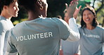 NGO, volunteer and high five with friends, outdoor or teamwork with clipboard for donation schedule. Nonprofit, community service and happy people with checklist, laughing and celebration for success