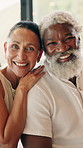 Happy, face and mature couple home for bonding, commitment and connection in marriage. Smile, portrait and woman with man in living room for embrace, affection and love for interracial relationship