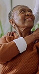 Old woman, smile and holding hands with daughter in home, connection and bonding together in lounge. Family, laughing and support for senior black person, love and happy with mother in living room