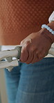 Hands, woman and walking at house with walker, balance and mobility support for rehabilitation. Rollator, assistance and person with disability, gait training and stability aid for physical therapy