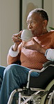 Tea, reflection and old woman in retirement home with wheelchair, vision or memories of past history. Coffee, thinking and senior black person with disability, wellness and daydream with nostalgia.