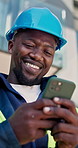 Technician, phone and man at construction site with laugh, browsing and notification for online meme. Low angle, black person and happy outdoor by building with tech, electrician job and funny text.