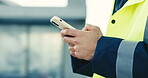 Hands, engineer and typing on phone for communication, construction or building development feedback. Technology, internet connection and worker with space for online compliance, site rules or app