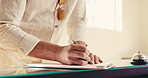 Travel, arrival or hands in hotel with form, client information or booking details for check in. Happy, person or receptionist with signature, reservation process or guest verification in lodge lobby