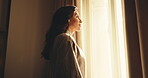Thinking, smile or woman in hotel room with window, trip reflection or calm moment on holiday break. Happy, below or mature person with daydream, peaceful perspective or mindfulness on vacation.