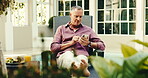 Hotel, holiday and senior man with phone, scroll and communication with contact on social media app. Browsing, message and retired person with mobile on vacation, internet connection and chat on web