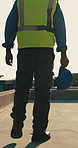 Walking, construction and back of man with helmet for building project, renovation and inspection. Engineering, city and person with ppe for safety compliance, remodeling or quality assurance outdoor