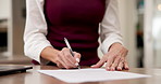 Woman, hands and writing with document for signature, legal agreement or contract confirmation. Female person, signing or form with paperwork or application for insurance or asset management in home