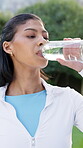 Break, water and woman in park with fitness, training pause and recovery with wellness activity. Hydration, cool down and person with bottle, workout rest and refreshing stop in outdoor exercise.