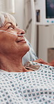 Healthcare, old woman and talking in hospital with support, medical update and smile for recovery. Senior patient, rest or discussion in ward for feedback, procedure information or happy with service