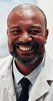 Medical, face and man in hospital with smile, clinical service and about us in wellness career. Happy, portrait and mature doctor with confidence, general practitioner or pride in healthcare industry