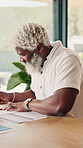 Document, remote work or man with notes in home for risk management, metrics or financial info. Mature black person, freelancer or writing on notebook for investment analysis, data or problem solving