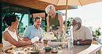 People, applause and serving cake with friends outdoor for celebration, birthday or social gathering. Mature men, women and happy or clapping hands for hosting, food and laughing together at house
