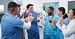 Doctor, meeting or medical team with applause in hospital for winning or achievement together. People, healthcare workers or clapping with smile for mission, congratulations or success in clinic