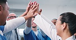 Hands together, doctors and team circle at clinic with goals, celebration and success in lobby. People, nurses or surgeon group with achievement, huddle and collaboration for motivation at hospital