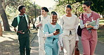 Nurse, phone and medical students walk outdoor with conversation, social media and college education. Happy, people and talk in park with tech, friends bonding and university for healthcare course.