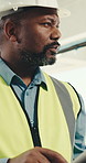Engineer, thinking and man with tablet, building or typing report for renovation project on website. Civil engineering, inspection and  mature black person with tech, scroll and property development