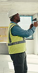 Engineer, tablet and man at construction site with picture, property evaluation or inspection report. Supervisor, mature black person and photography on building with tech, compliance or engineering.