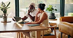 Senior, couple and laptop with invoice for budget, retirement planning and bills discussion. People, track online expenses and monitor annuity account for asset management with paperwork at home