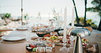 Party, meal or charcuterie board outdoor with candles, sushi arrangement or table setup at gathering. Celebration, nutrition or catering with platter, appetizer or assorted food in backyard event.