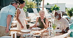 Celebration, hug or friends outdoor with handshake, greeting or happy moment with bonding meal. Reunion, smile or mature people with embrace, backyard party or friendly hello at social gathering.