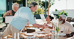 Celebration, gift or friends outdoor with handshake, greeting or happy moment with bonding meal. Reunion, hug or mature people with present, backyard party or friendly hello at social gathering.