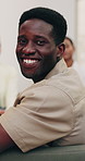 Counseling, smile and face of man with group session, wellness career and mental health support. Portrait, happy person and therapist with patients, psychologist or about us in peer intervention
