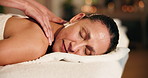 Spa, woman and relax on bed with back massage, tranquility and hospitality in luxury accommodation. Bokeh, mature person and sleep in hotel with body care, masseuse and wellness retreat for serenity.