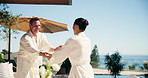Couple, excited and dance at resort with love, anniversary milestone and space on travel vacation. Mature people, happy and holding hands at pool with spin, second honeymoon and hug outdoor at spa