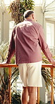 Travel, back or man on balcony with thinking, trip mindset or calm moment on summer holiday. Relax, reflection or mature person with mindfulness, tourist inspiration or peaceful perspective in hotel.