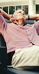 Mature, man and stretching on chair for holiday, weekend getaway or vacation in luxury retreat. Male person, relax or lying with break, rest or stress relief for comfort, accommodation or hospitality