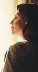 Morning, woman and thinking in lodge with window, peaceful holiday or daylight to wake up on weekend. Calm, mature person start day and reflection in hotel room with view, wellness and vacation.