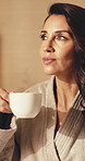 Woman, relax and drink coffee in hotel room with peace, travel vacation and tranquility in morning. Calm, mature person and rest in accommodation with beverage, reflection and unwind for holiday.