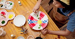 Above, woman and painting in class with pottery, sculpture and custom design of handmade craft. Female person, paint brush and decorating in workshop with clay bowl, artistic process and diy creation