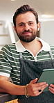 Face, man and waiter at cafe with tablet, research and inventory management for menu update. Portrait, person and smile at coffee shop with digital, stock checklist and increase price for hospitality