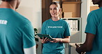 Volunteer, team and manager in charity with tablet, discussion and guidance for non profit project. Woman, people and conversation in NGO with tech, management or instructions for outreach initiative