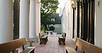 College, empty or campus with outdoor bench, tertiary institution or chairs in learning environment. Education, vacant or student building with seats, architecture or academic faculty in university.