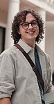 Face, student and man at university campus for knowledge, development and scholarship with smile. College, portrait and happy male person with books, learning opportunity and education outdoor
