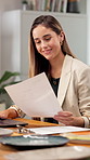 Woman, reading and laptop with document for pottery, confirm booking and report for update pricing. Smile, owner and paperwork in office with pc, availability and material invoice for online purchase