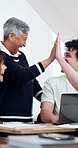 Lecturer, students and high five in university with laptop, education or happy with assignment grade. Teacher, people and smile in college class with computer, well done or celebration for pass mark.