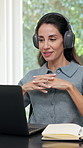Headphones, laptop or woman in home with video call, funding review or advice in remote work. WFH, digital or mature finance advisor with tech, investment inquiry or discussion in online meeting.