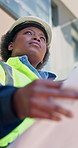 Construction, black woman or blueprint for site inspection, external finishing or building approval. Low angle, qa inspector and layout for civil handover audit, architecture integrity or regulations