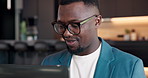 Remote work, glasses and happy man with laptop in home, accountant or tax preparation with research. Freelance, bookkeeper and black person with tech for budget, online and financial report in house