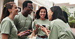 Volunteering, friends and happy people with phone, outdoor and social responsibility for non profit. NGO, online and team with mobile, laughing and reading funny post on web and bonding on break
