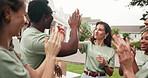 Happy, volunteer and team with high five in city for community service, mission or winning. People, NGO or group clapping with applause for aid, donation or charity success together in urban town