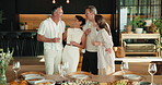Happy, group and friends in home for dinner party, celebration and social gathering on weekend. House, hosting and people with conversation, reunion and meal for bonding, connection and visit